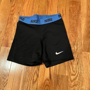 Small Black Nike Pros with blue band
